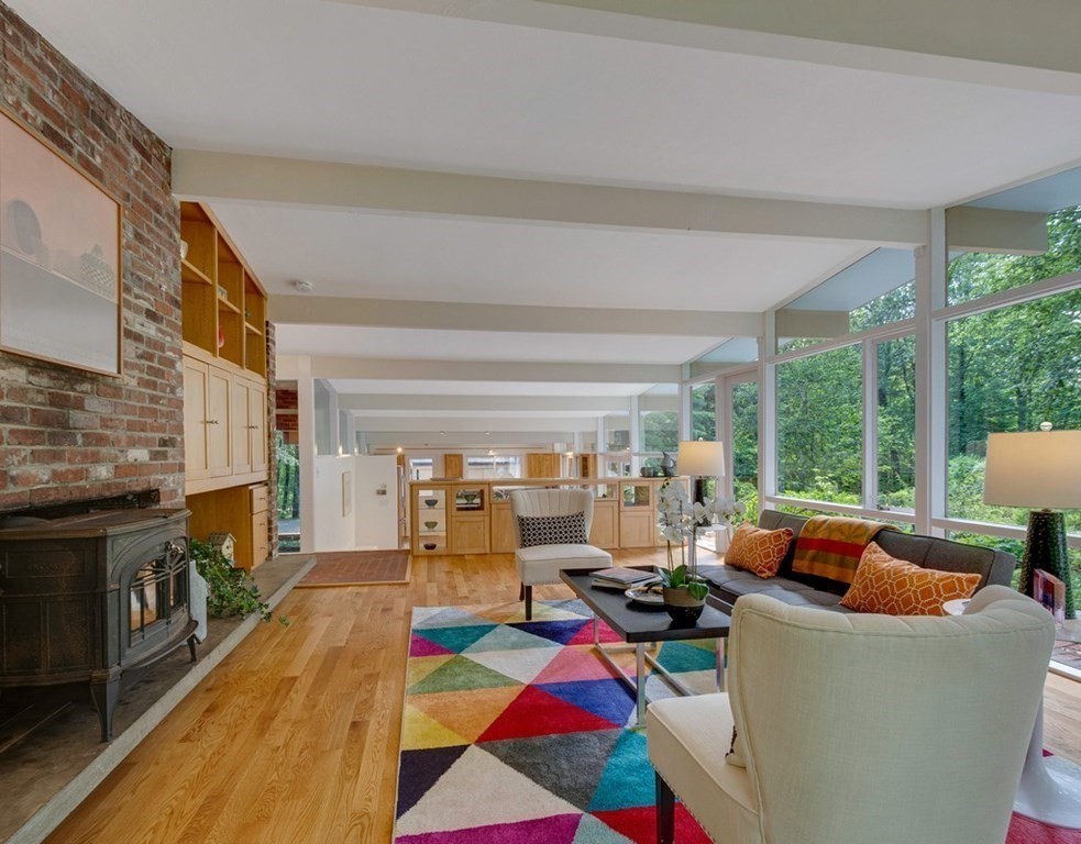 64 Baker Bridge Road Lincoln, MA 01773 - Photo 3 of 34 a living room with furniture fireplace and a large window