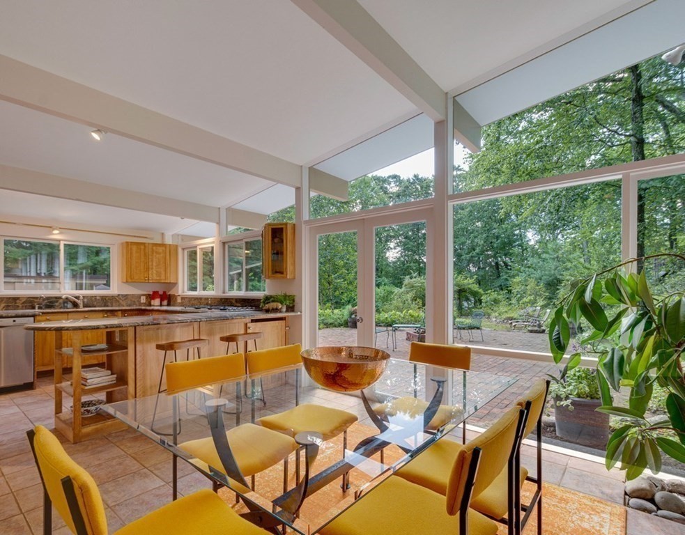 64 Baker Bridge Road Lincoln, MA 01773 - Photo 4 of 34 a view of a dining room with furniture window and outside view