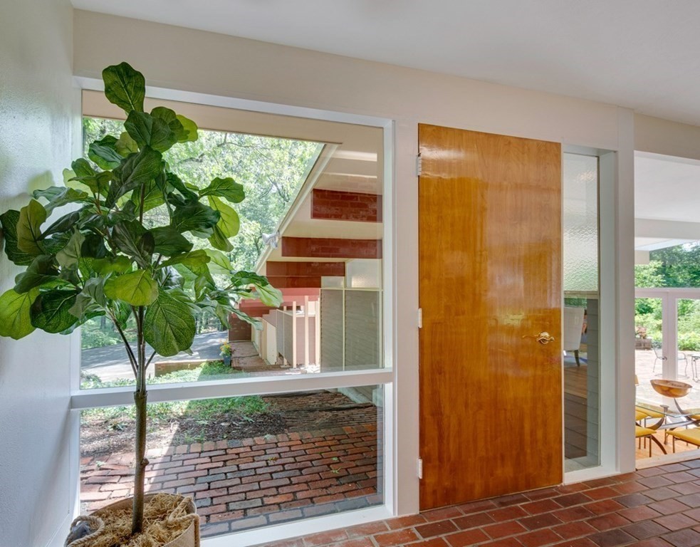 64 Baker Bridge Road Lincoln, MA 01773 - Photo 7 of 34 a house that has glass windows