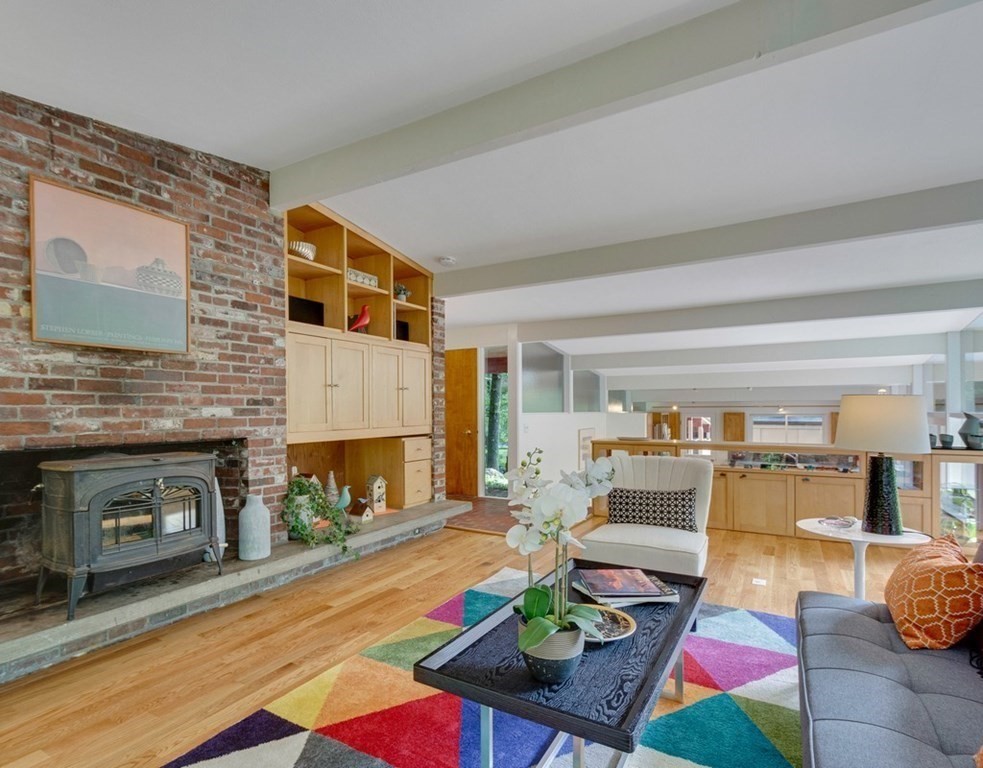 64 Baker Bridge Road Lincoln, MA 01773 - Photo 10 of 34 a living room with fireplace furniture and a fireplace