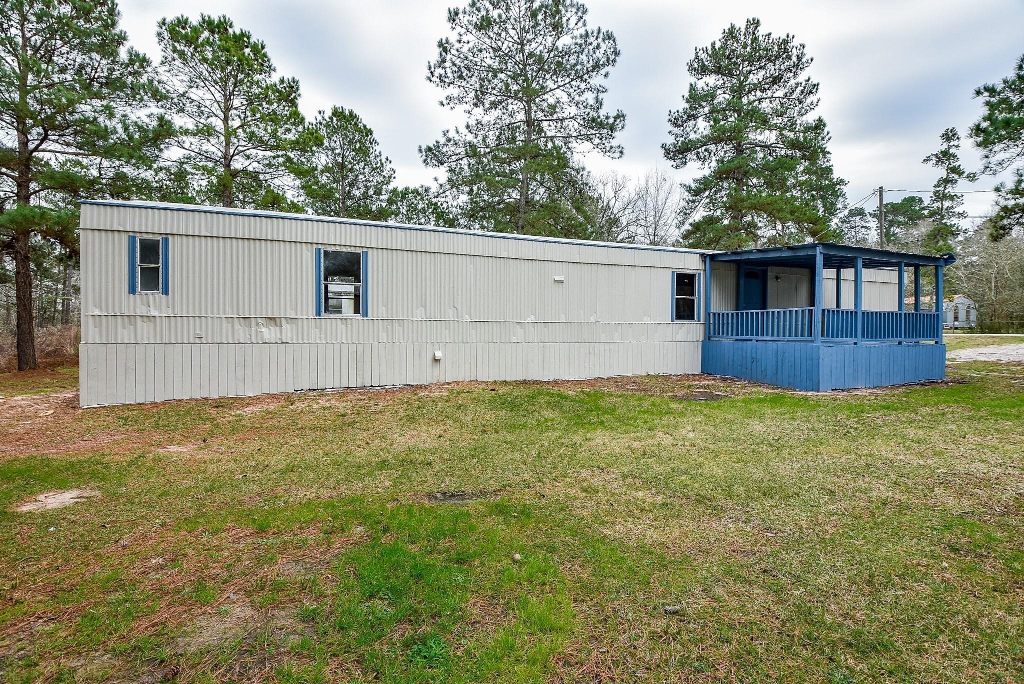 12842 Roy Harris Loop Conroe, TX 77306 - Photo 10 of 36 a view of a backyard