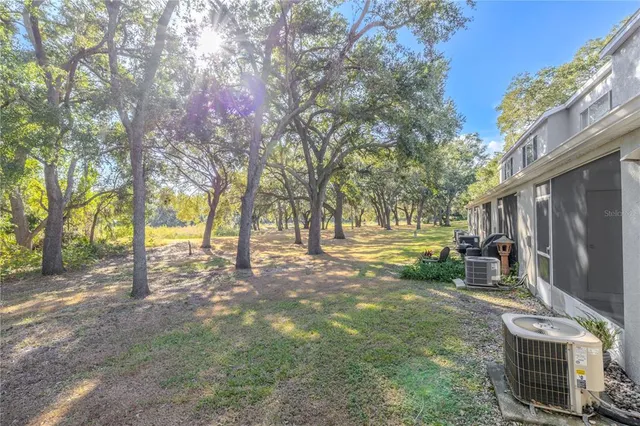 a backyard of a house with lots of green space
