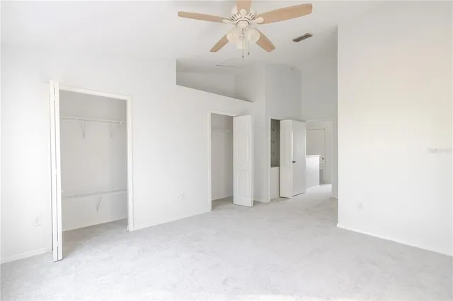 a view of a hallway with a chandelier