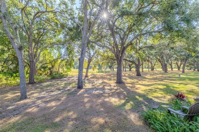 a small pool with outdoor seating and yard