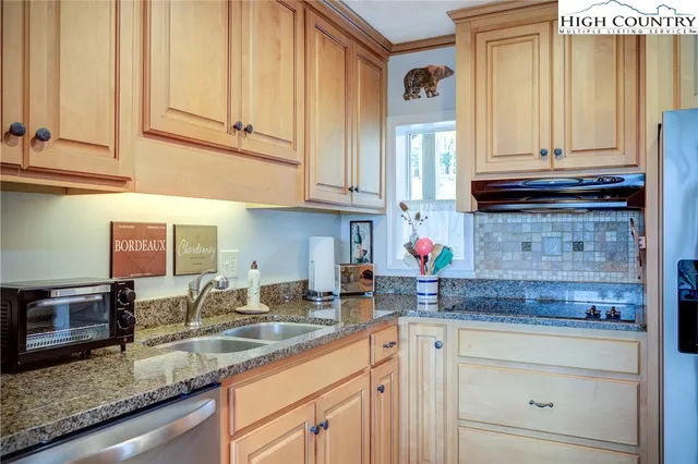 a bathroom with a toilet sink vanity tub and shower