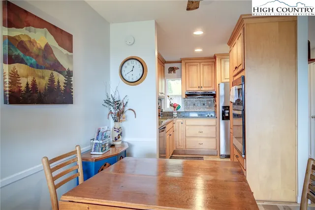 a view of a balcony with wooden floor and outdoor space