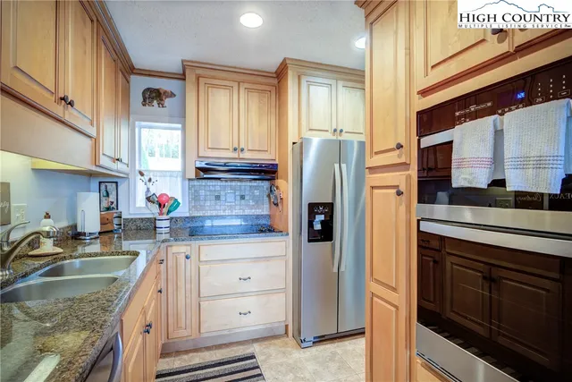 a view of a lush green hillside and a building in the background
