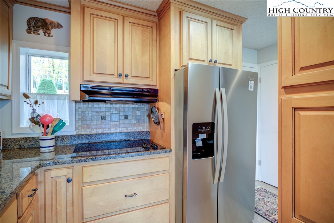 367 Skyleaf Drive, Unit D8 Banner Elk, NC 28604 - Photo 18 of 43 a kitchen with stainless steel appliances granite countertop a refrigerator and a sink