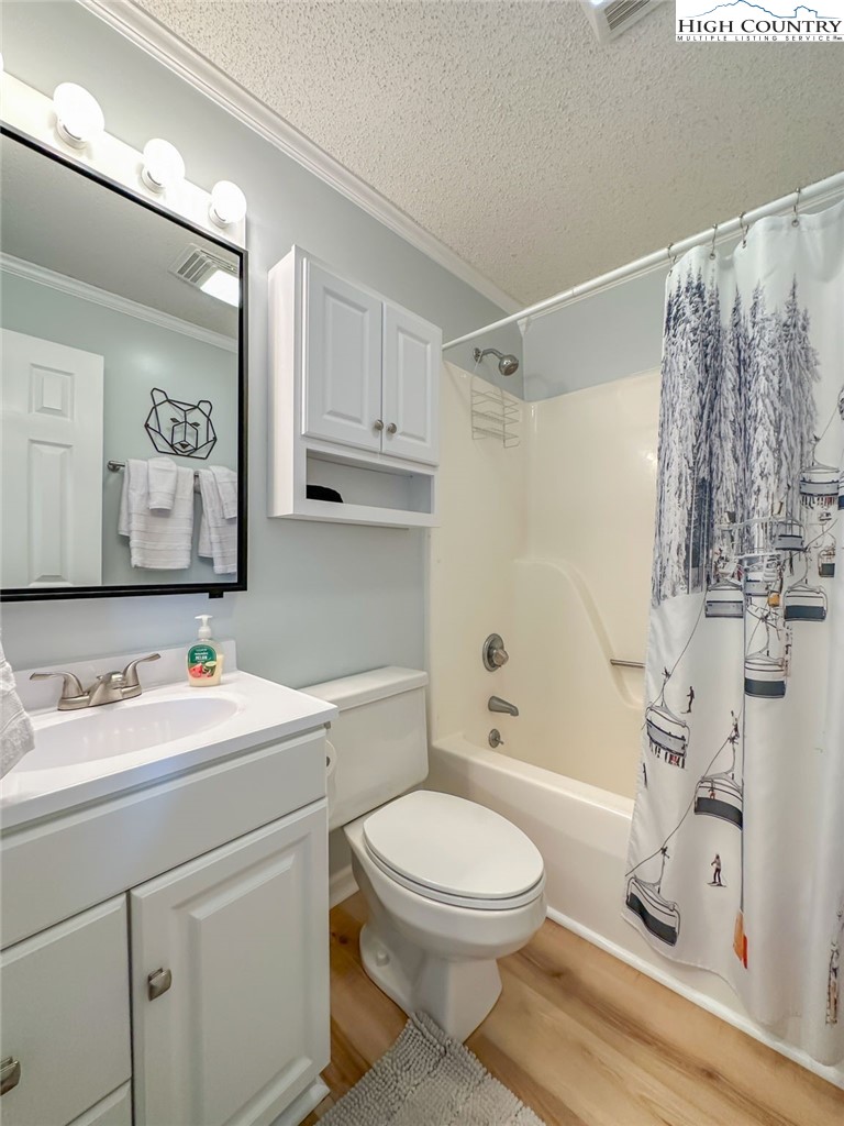 367 Skyleaf Drive, Unit D8 Banner Elk, NC 28604 - Photo 20 of 43 a bathroom with a toilet sink vanity tub and shower