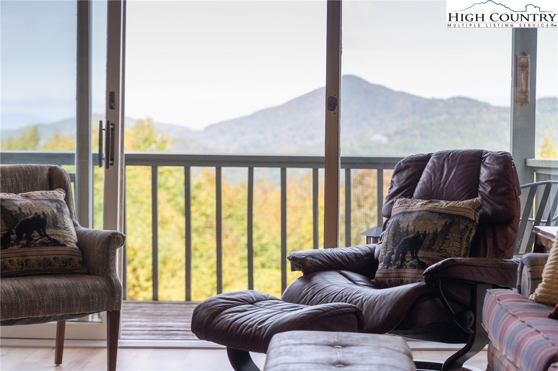 367 Skyleaf Drive, Unit D8 Banner Elk, NC 28604 - Photo 2 of 43 a living room with furniture and a large window