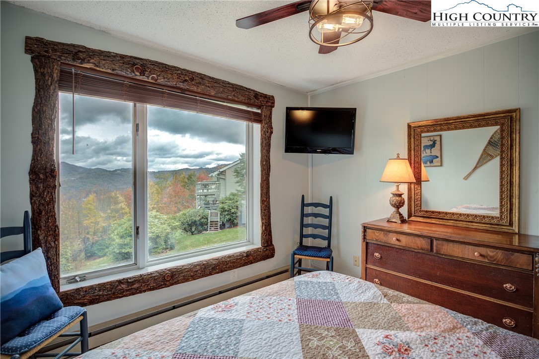 367 Skyleaf Drive, Unit D8 Banner Elk, NC 28604 - Photo 22 of 43 a bedroom with a bed and a television
