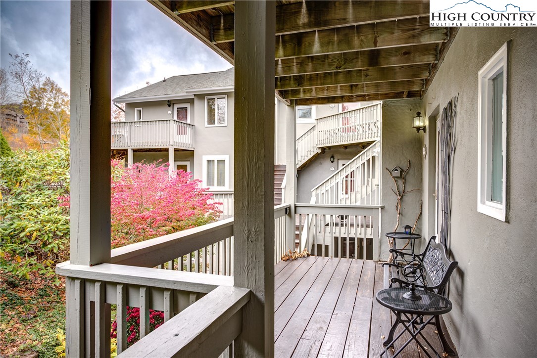 367 Skyleaf Drive, Unit D8 Banner Elk, NC 28604 - Photo 27 of 43 a view of a balcony with wooden floor and outdoor space