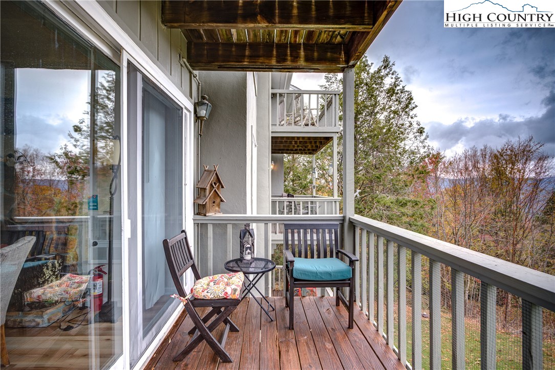 367 Skyleaf Drive, Unit D8 Banner Elk, NC 28604 - Photo 4 of 43 a view of a balcony with furniture