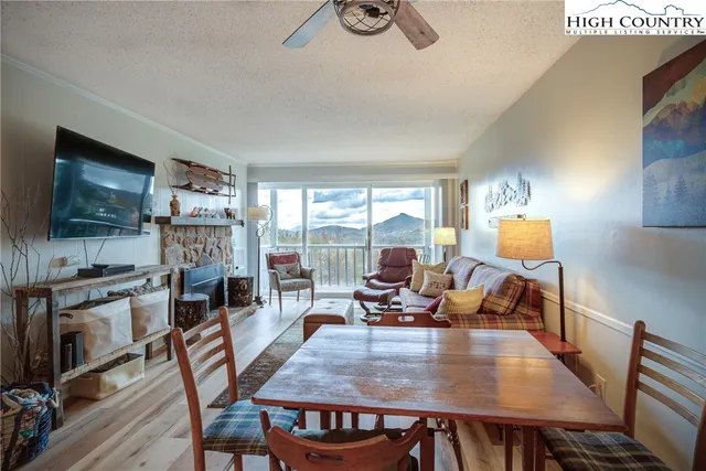 a kitchen with stainless steel appliances granite countertop a sink a stove and cabinets