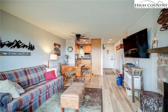 a bedroom with a large bed and a large window