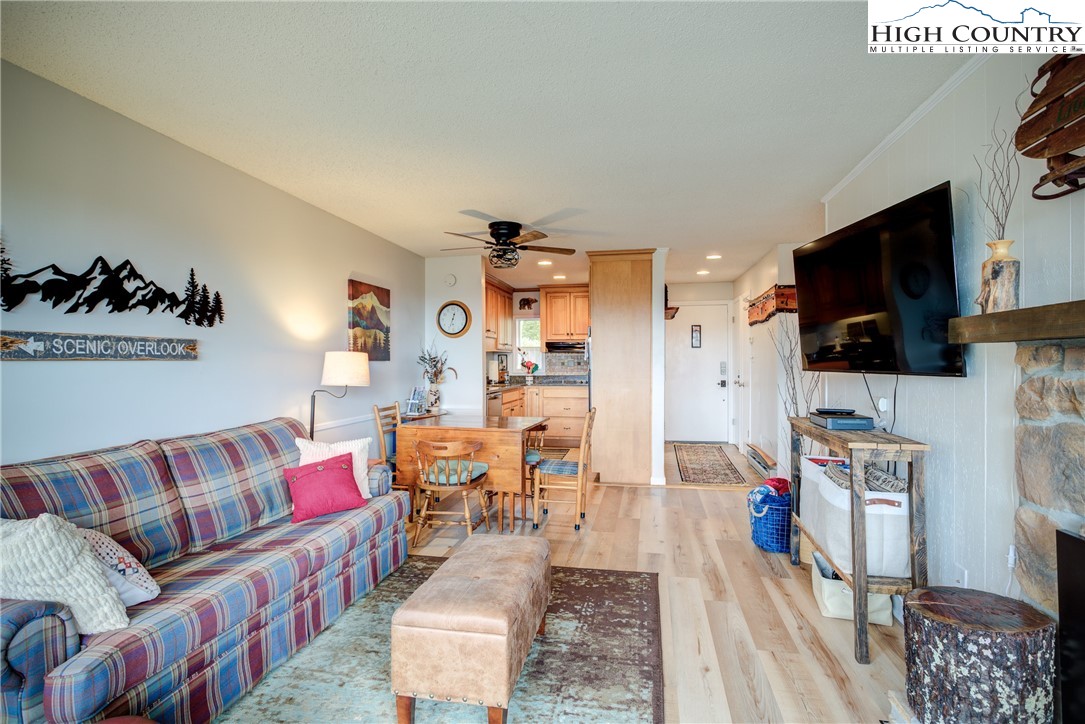 367 Skyleaf Drive, Unit D8 Banner Elk, NC 28604 - Photo 9 of 43 a living room with furniture and a flat screen tv