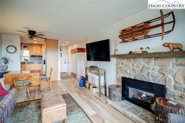 a kitchen with stainless steel appliances granite countertop a refrigerator and stove top oven