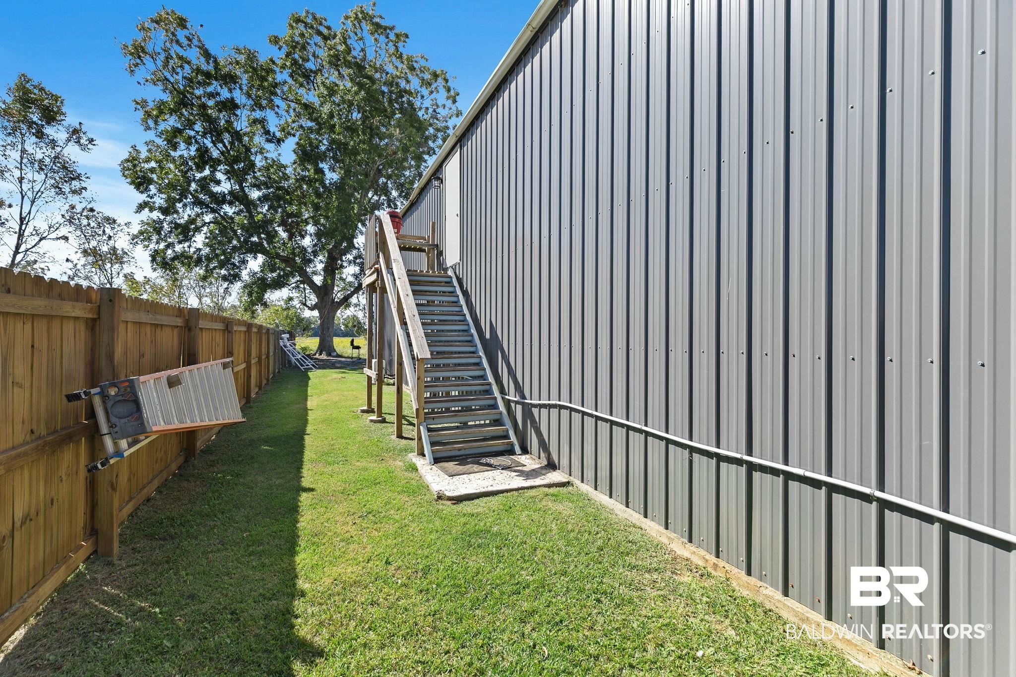 16796 Thompson Road Loxley, AL 36551 - Photo 67 of 93 Fenced backyard featuring stairway