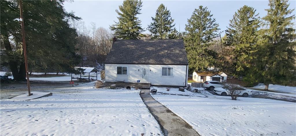 4011 Fisher Road includes the detached garage/workshop on the right side of the photo