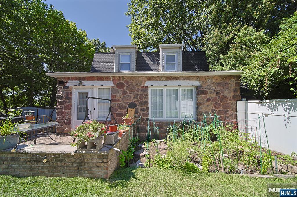 1585 Bergen Boulevard Leonia, NJ 07605 - Photo 11 of 50 front view of a house with an outdoor space