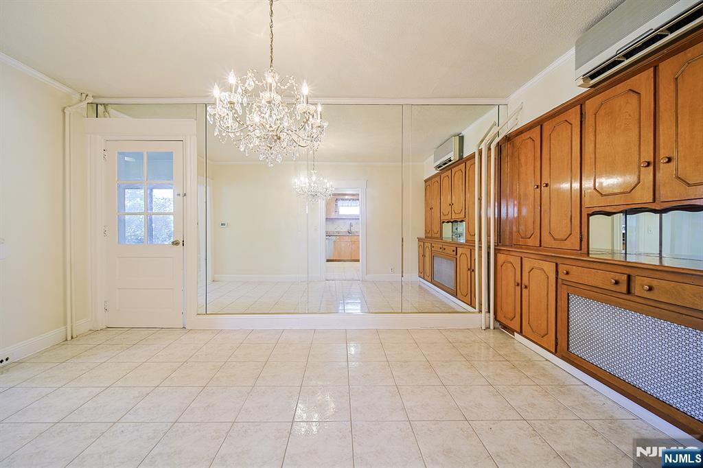 1585 Bergen Boulevard Leonia, NJ 07605 - Photo 25 of 50 a view of an entryway with chandelier
