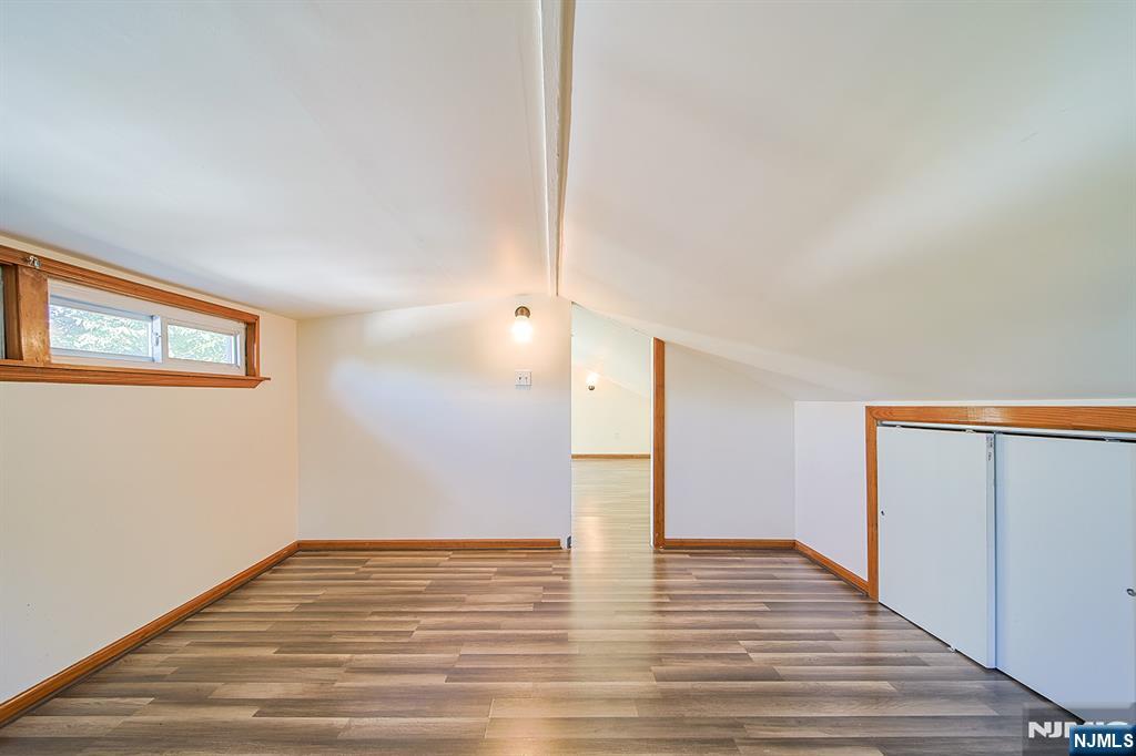 1585 Bergen Boulevard Leonia, NJ 07605 - Photo 46 of 50 a view of an empty room with wooden floor