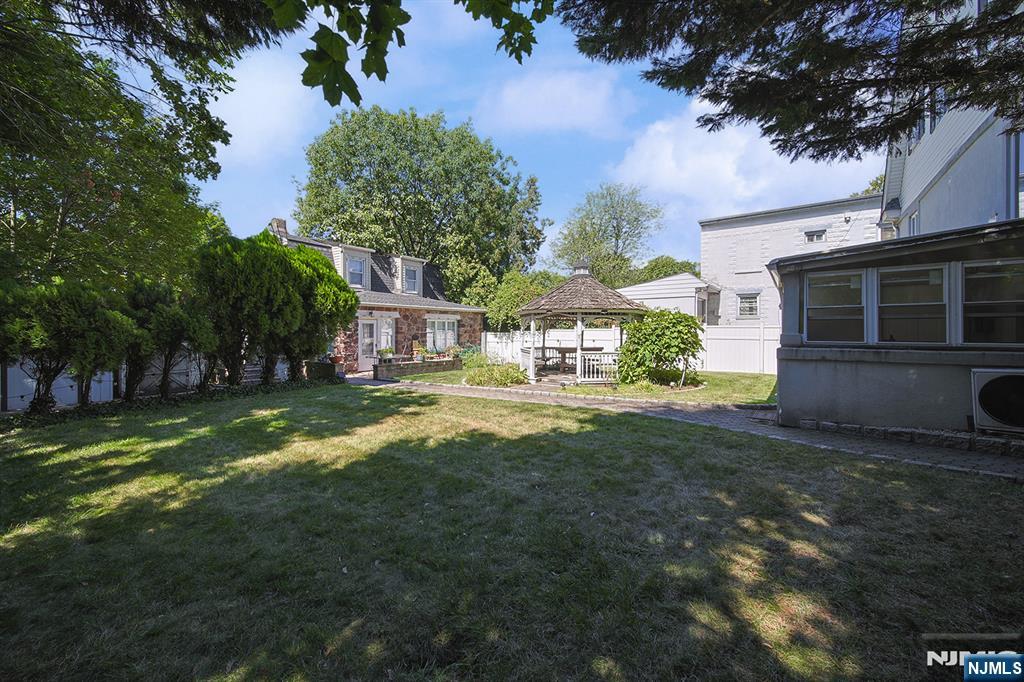 1585 Bergen Boulevard Leonia, NJ 07605 - Photo 5 of 50 a view of a house with a yard