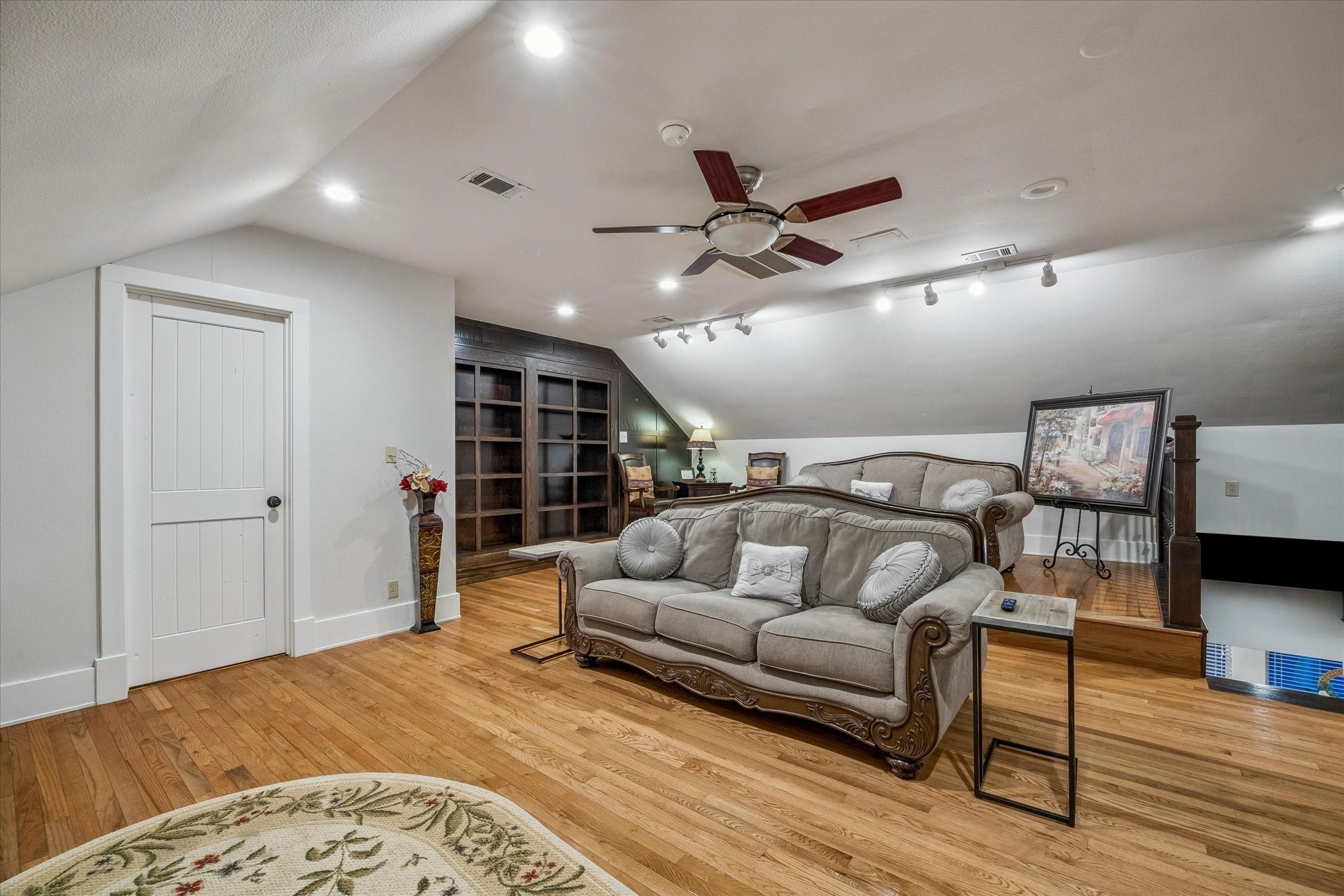 3515 County Road 36 Angleton, TX 77515 - Photo 33 of 50 a living room with furniture and a wooden floor