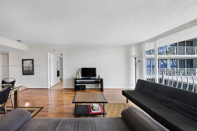 a kitchen with sink a faucet and chairs