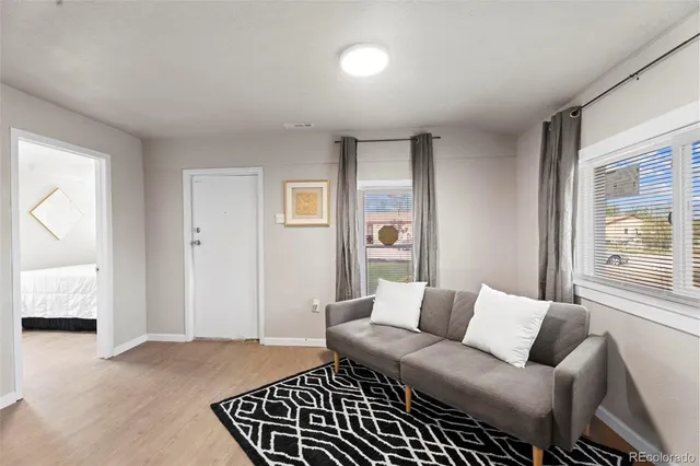 a living room with furniture and a window