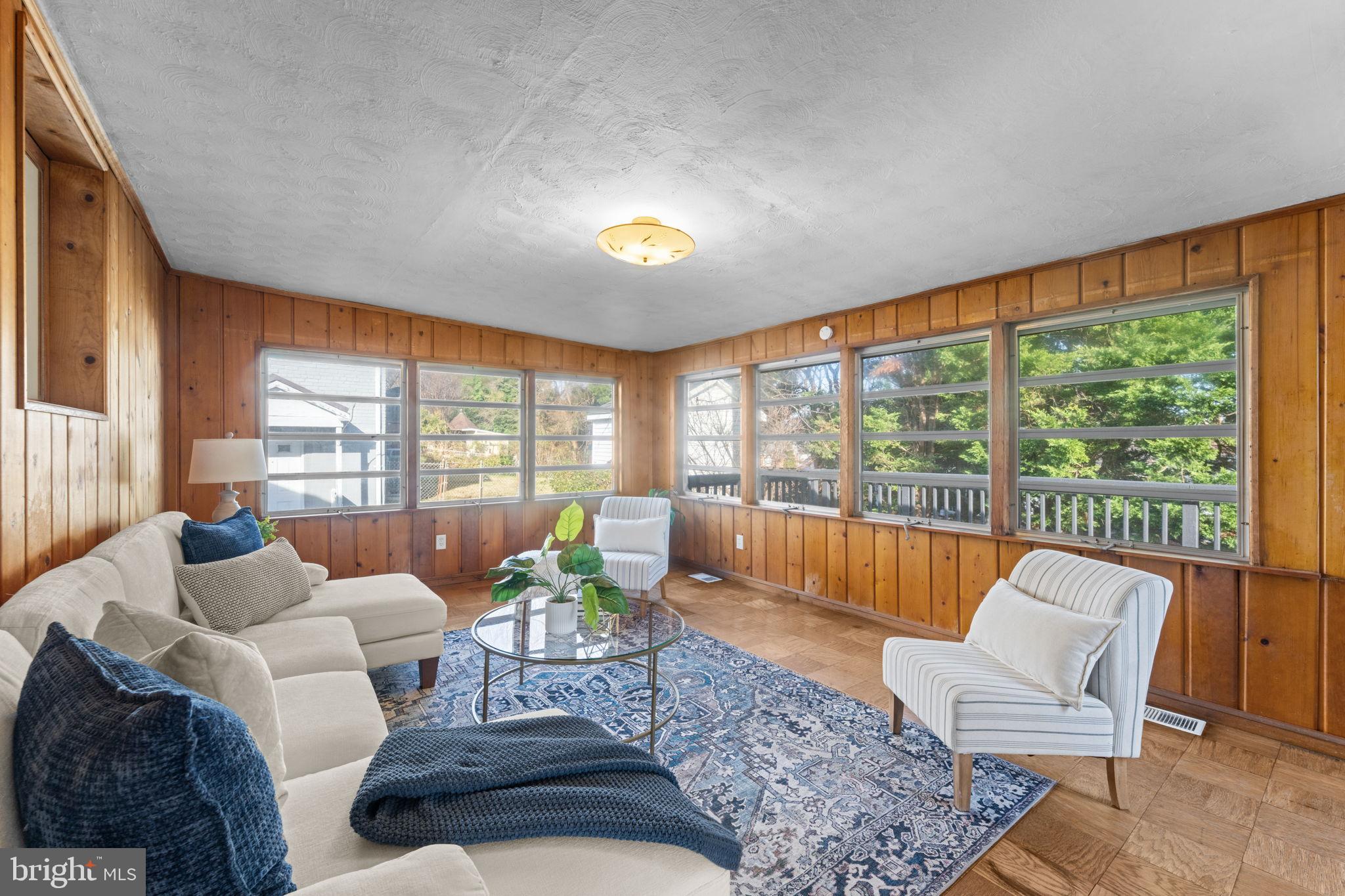11013 Amherst Avenue Silver Spring, MD 20902 - Photo 13 of 74 a living room with furniture and a large window