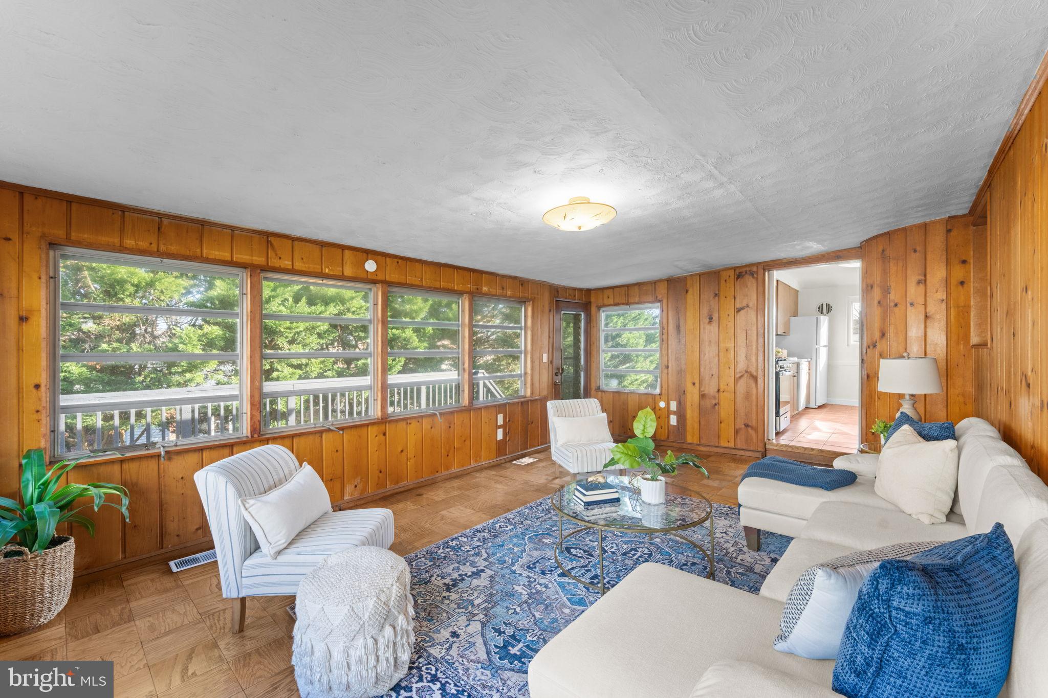 11013 Amherst Avenue Silver Spring, MD 20902 - Photo 15 of 74 a living room with furniture and a large window