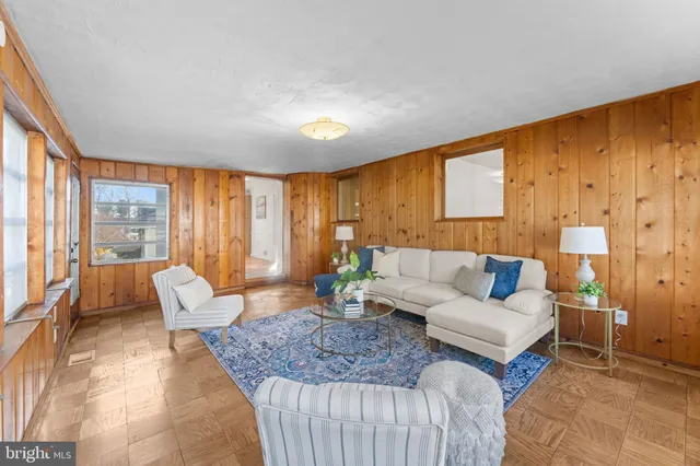 a bedroom with a bed a table and chair