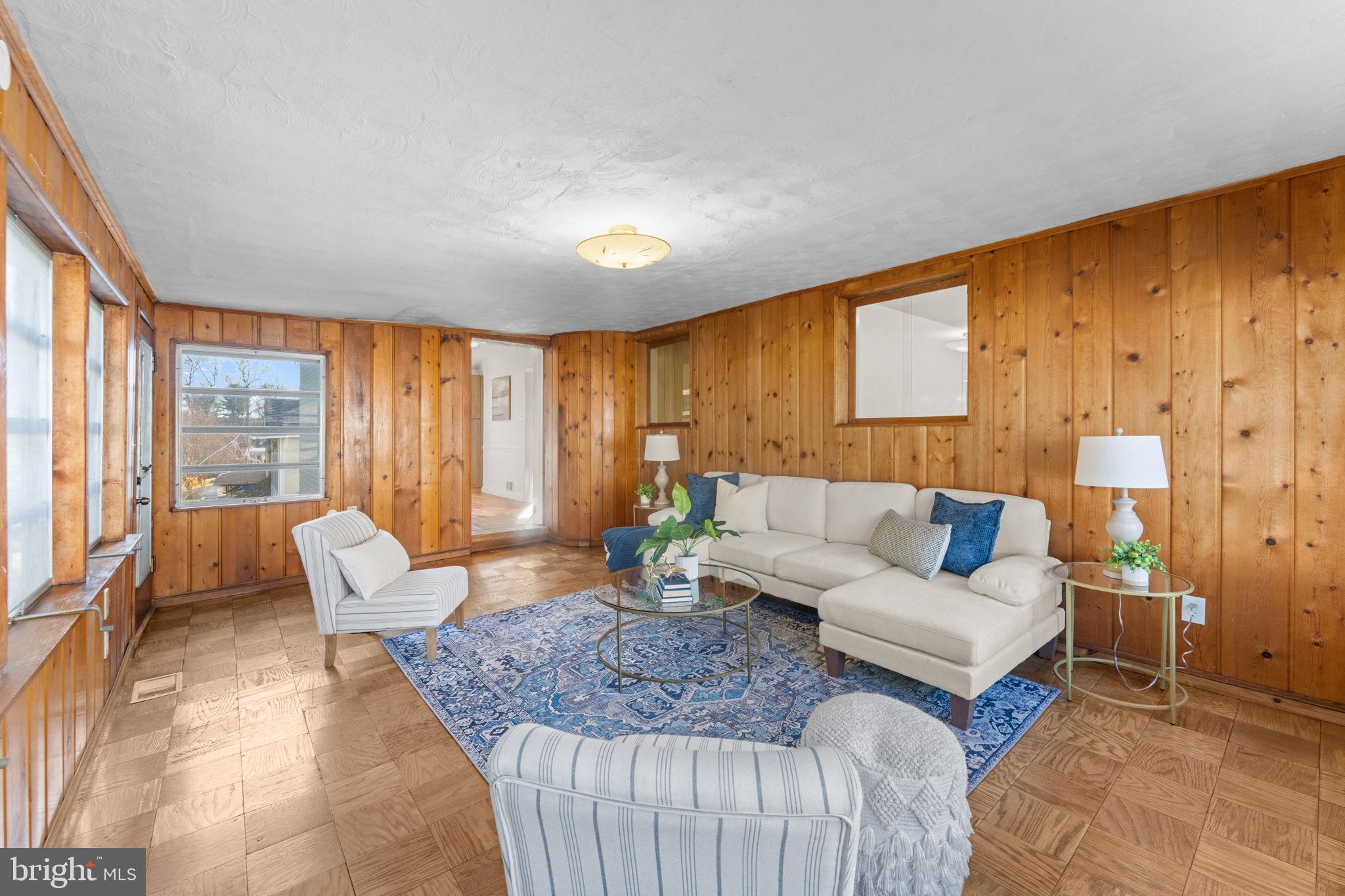 11013 Amherst Avenue Silver Spring, MD 20902 - Photo 16 of 74 a living room with furniture and a large window