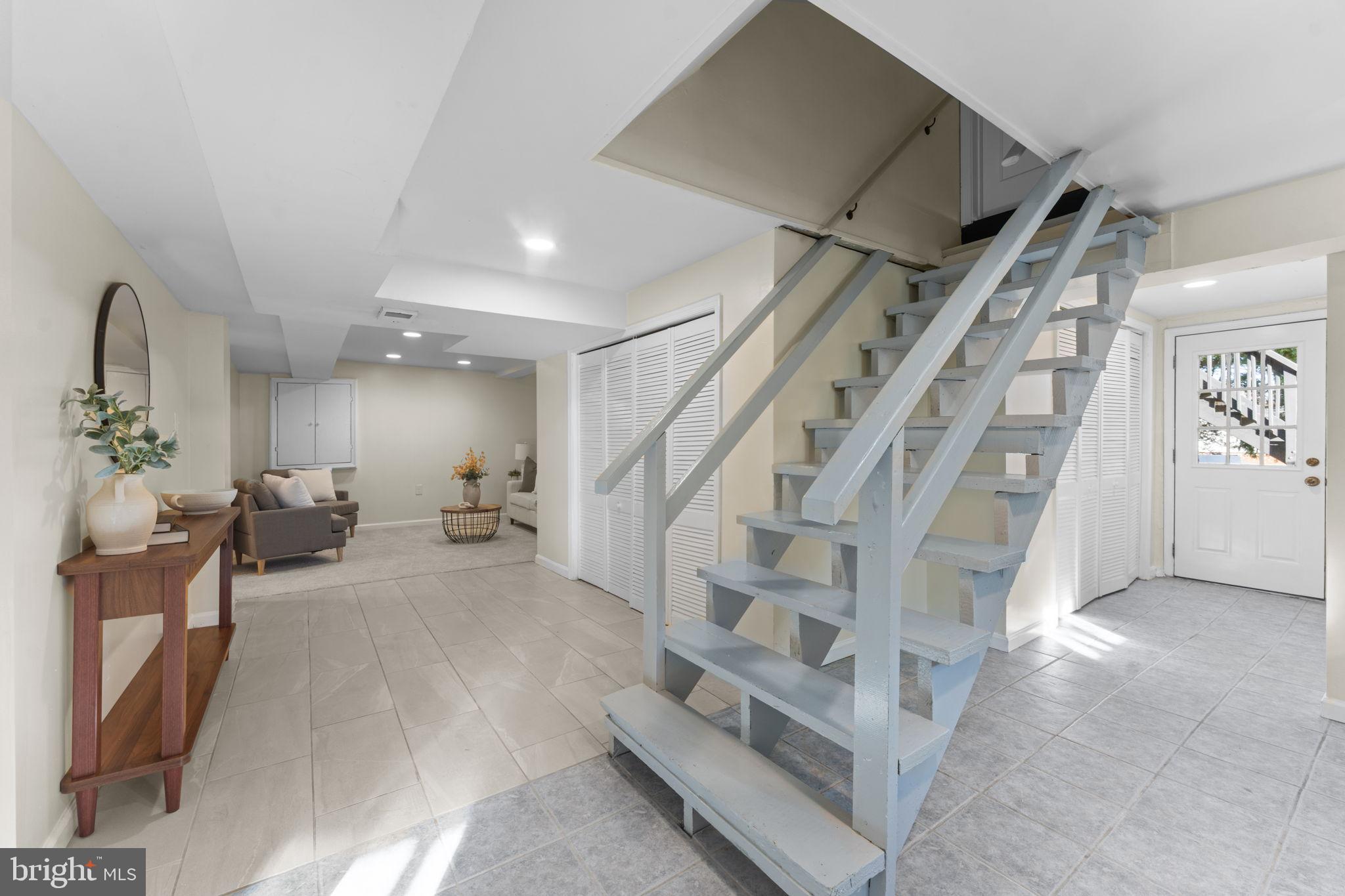 11013 Amherst Avenue Silver Spring, MD 20902 - Photo 26 of 74 Bright and inviting entryway with stairs.