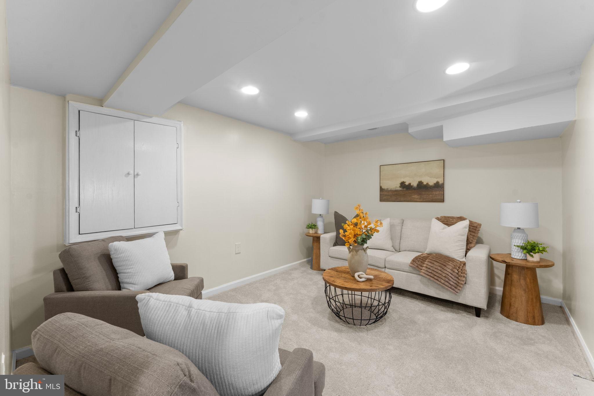 11013 Amherst Avenue Silver Spring, MD 20902 - Photo 35 of 74 a living room with furniture and a table