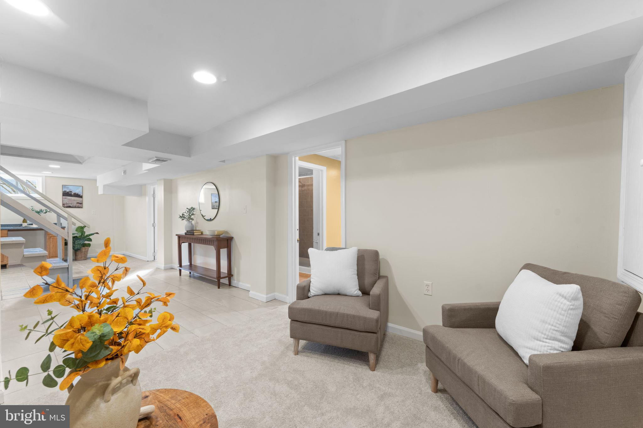 11013 Amherst Avenue Silver Spring, MD 20902 - Photo 36 of 74 a living room with furniture and a couch