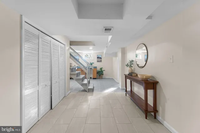 a view of a house with pool and sitting area