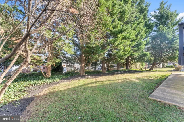 a group of people sitting in front of a building
