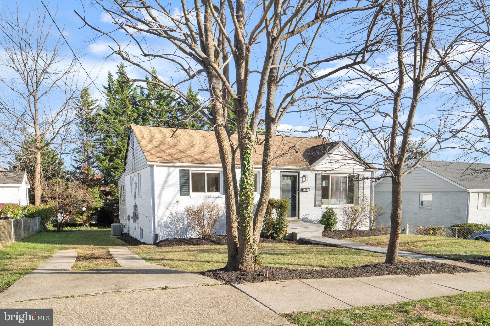 11013 Amherst Avenue Silver Spring, MD 20902 - Photo 56 of 74 a front view of a house with a yard