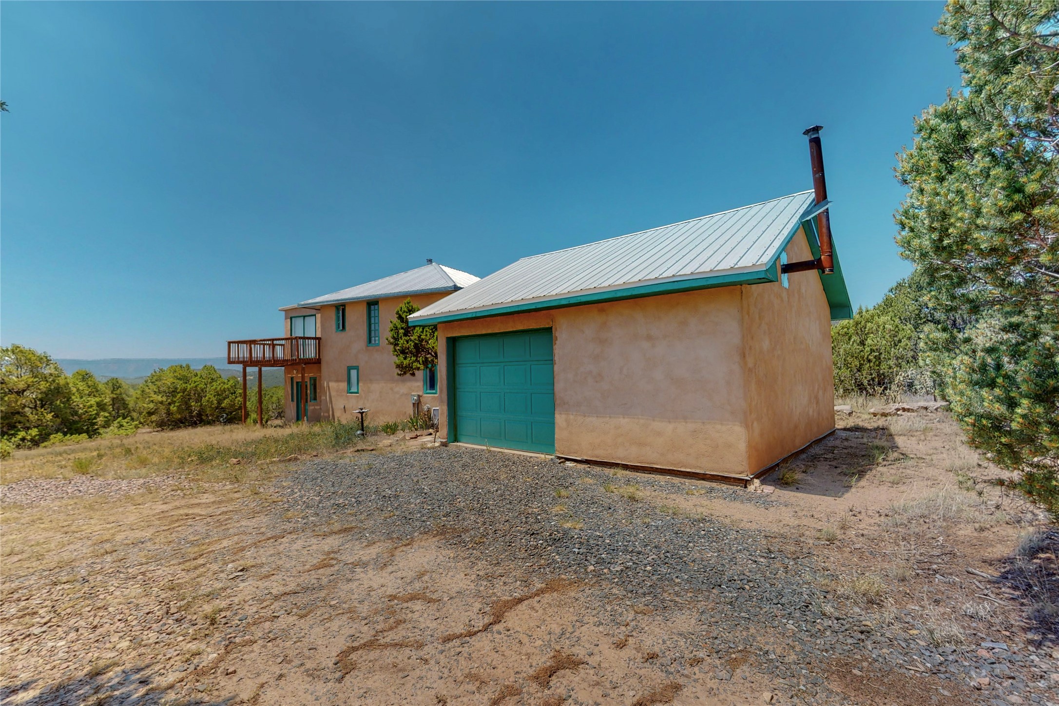 175 Hidden Valley Ranch Road Ilfeld, NM 87538 - Photo 39 of 43 South view of garage/shop and home