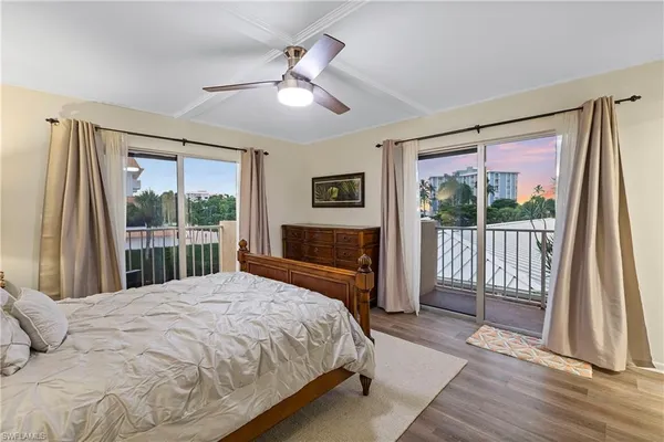 a bedroom with a large bed and a large window
