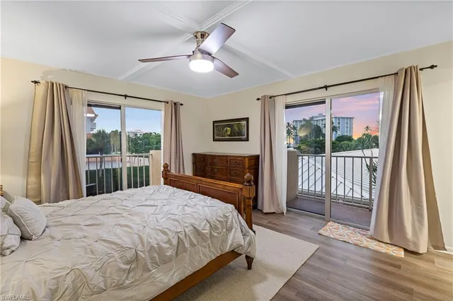 a bedroom with a large bed and a large window
