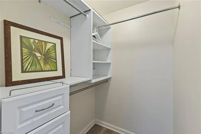 a view of storage and utility room with a window