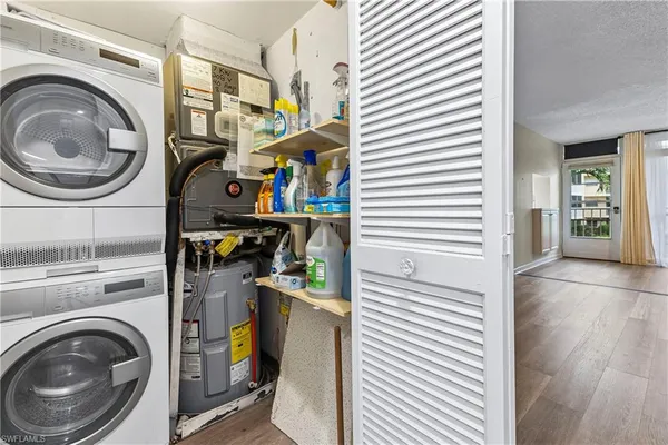 a view of a hallway with washer and dryer