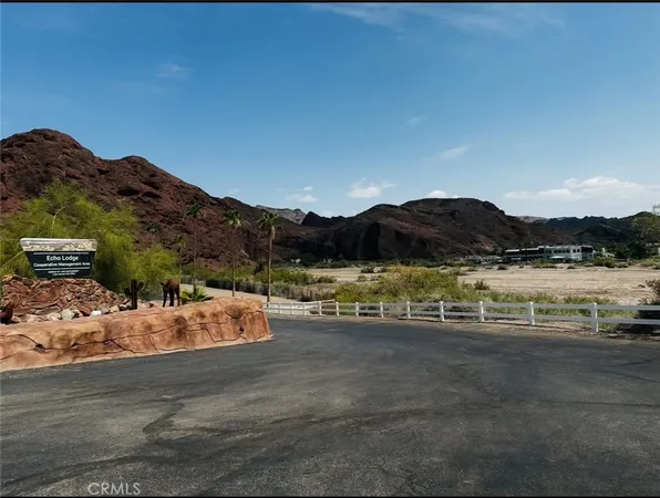 a view of a lake with mountain in the background