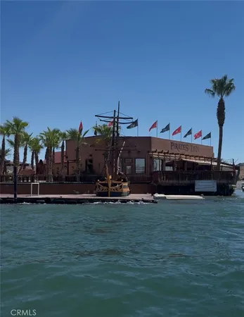 a view of a swimming pool with an outdoor seating and a window