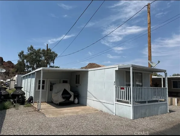 a view of porch with furniture and a garage