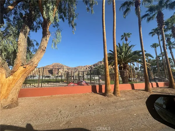 a view of a street with a building in the background