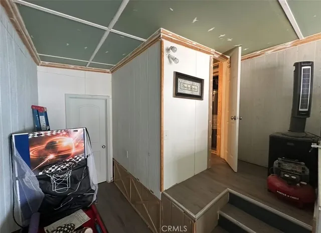 a view of room with window and wooden floor